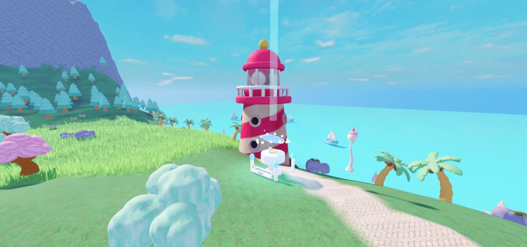 Lighthouse Point by day: a pink-and-white candy-striped lighthouse at the end of a brick trail, palm trees and sailboats on a turquoise sea
